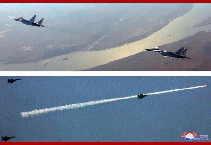 『金正恩』金正恩视察西部地区歼袭机部队,表示极大满意